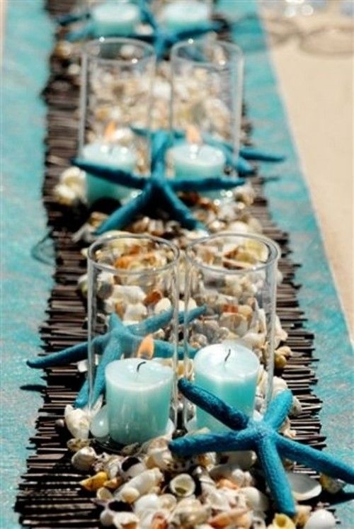 A Beach Themed Table Setting  Beach candle, Table decorations, Beach table  decorations